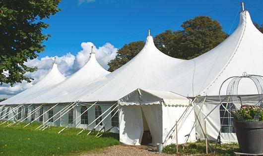 a row of portable restrooms placed outdoors for attendees of a special event in Franklin, MA